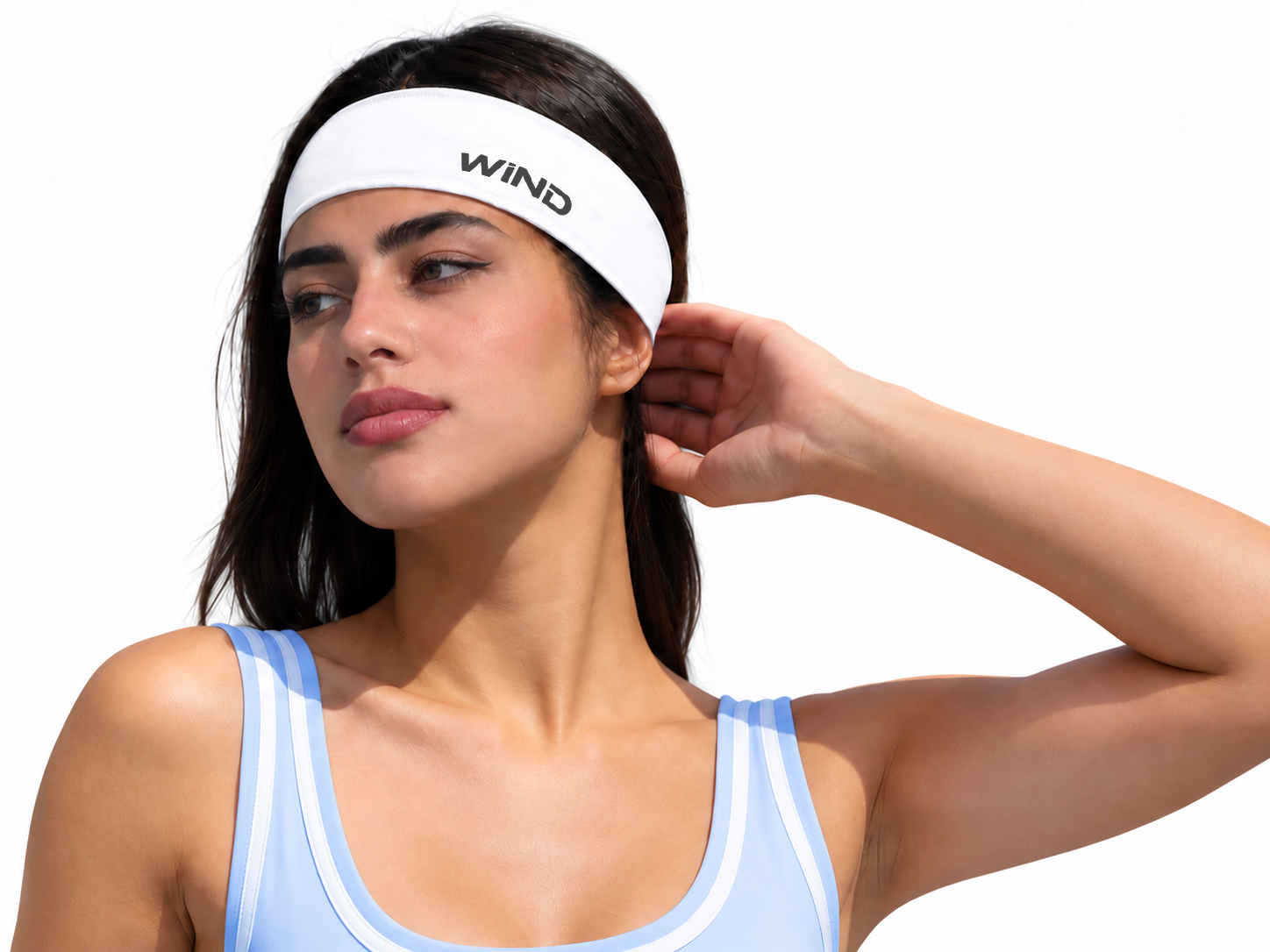 A woman looking down wearing a white Big Bang Lite headband